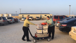 CARA volunteers wheel legal materials into Dilley family detention camp